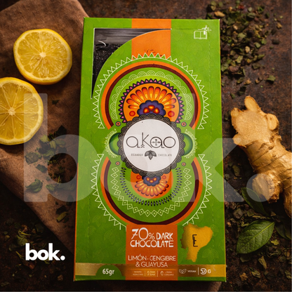 Chocolate dark 70% con limón, jengibre y guayusa, empaque premium de diseño artístico en escena lifestyle minimal elegante, chocolate ecuatoriano de perfil fresco y botánico, curado por BOK Concept Store